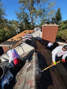 Professional roofing crew installing new roof in Oakland County MI